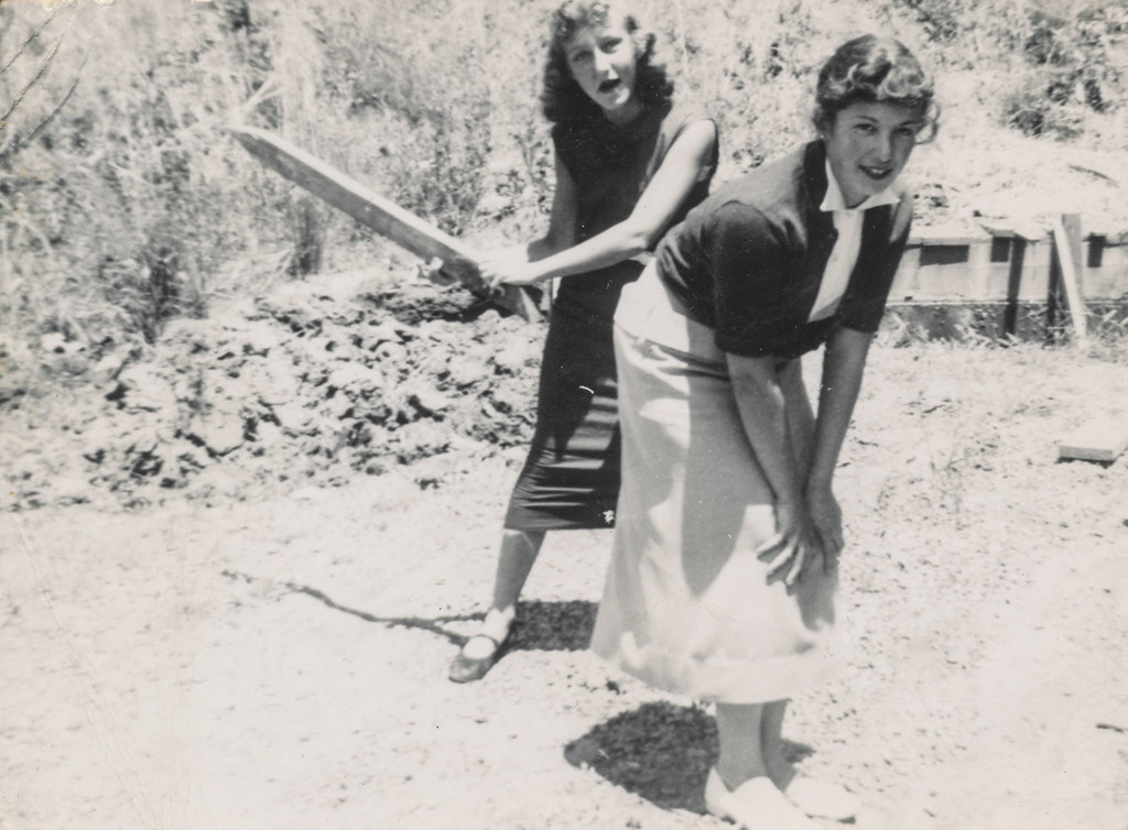 Woman spanks her friend with a paddle, Nancy Davis, Carol …
