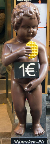 Chocolate Mannekin Pis with a waffle in Brussels, Belgium