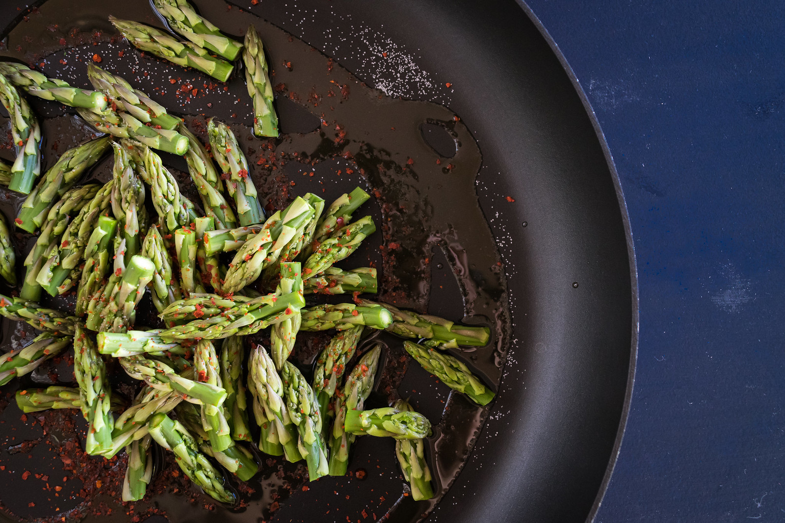 sautéing the asparagus tips with aleppo pepper