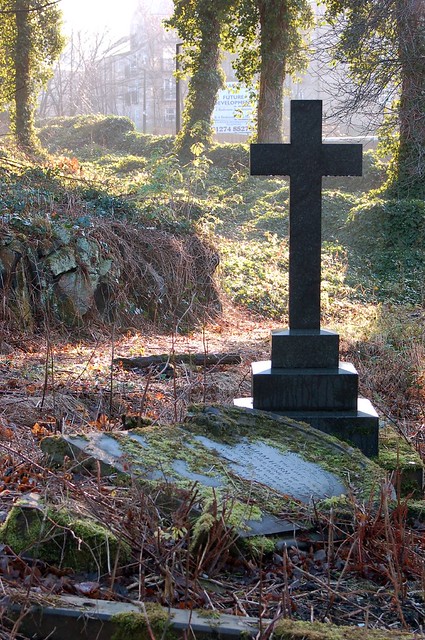 Cross and fallen headstone