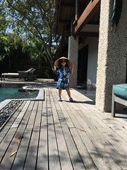 Sarah w sunglasses, hat and pool in Viet resort