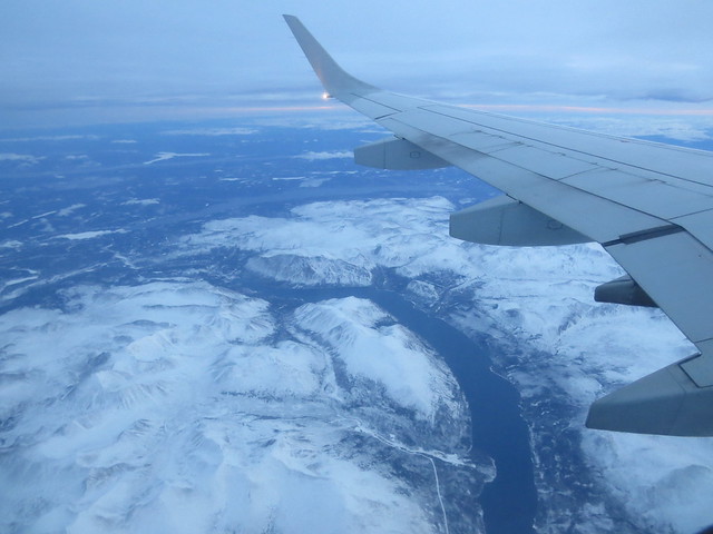 Flying over unfrozen Surprise Lake in Air Canada Embraer E-190 plane northeast of Atlin, BC