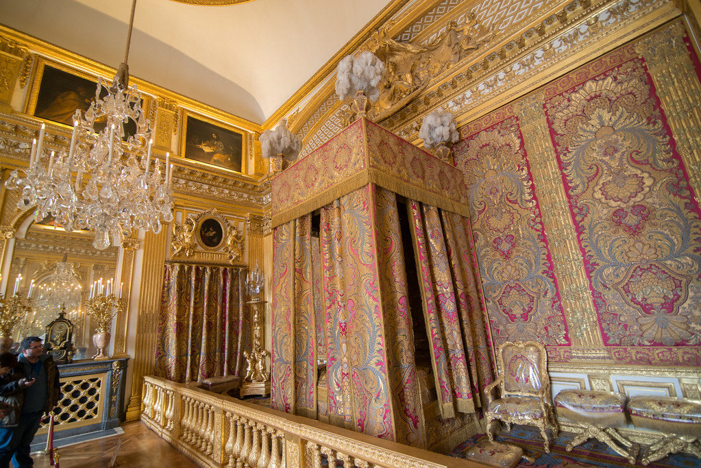 A grand, gold apartment of the king at the Palace of Versailles.
