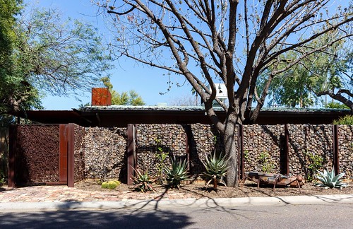 Ralph Haver House (1950s-60s) behind modern stone and metal fence