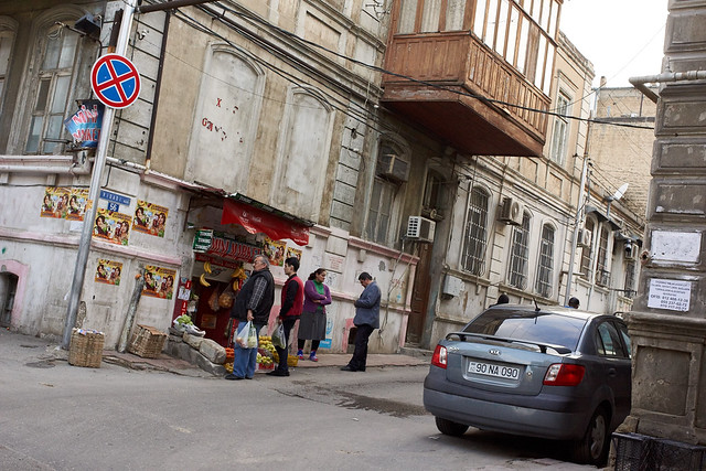 Men at the corner shop, Baku