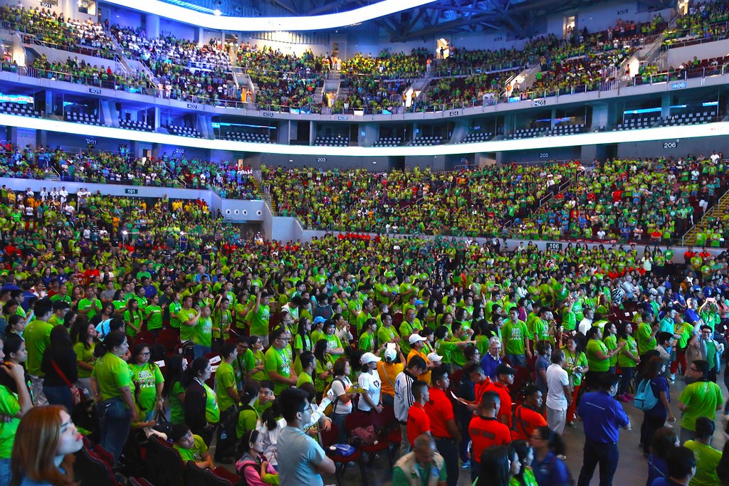The image shows many participants attending Angels Walk 2016 in Mall of Asia Arena.