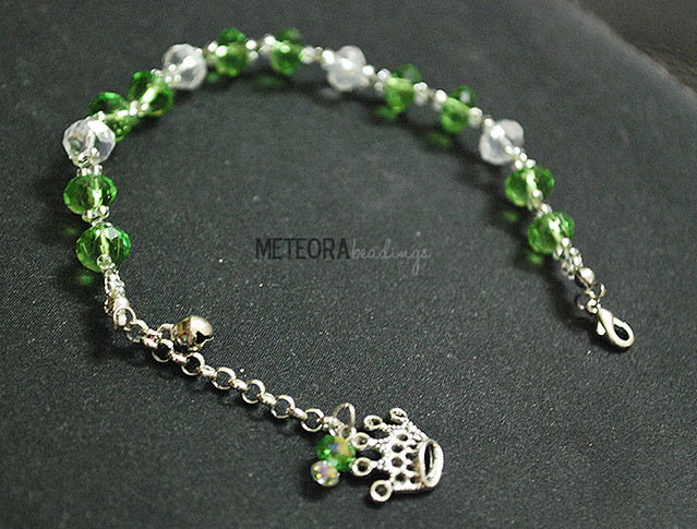 Bracelet - green and clear beads with silver crown charm