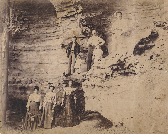 Group posing in a cave formation