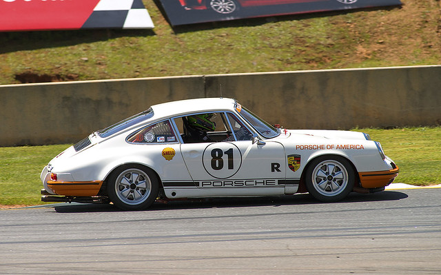 Porsche 911 leaning into a curve at the Mitty