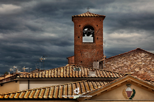old city roof italy sunlight tower horizontal architecture clouds outdoors photography town coatofarms day nopeople lucca crest tuscany townscape stormysky antennas crowded traveldestinations buildingexterior colourimage elevatedview italianculture