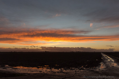 Storm Clouds and Puddles, San Joaquin County, CA by 4 Corners Photo, The remaining clouds from a winter storm are reflected in puddles in a freshly plowed field in San J