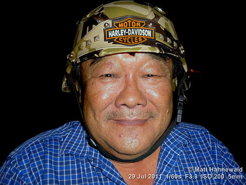 cultural character portrait crashhelmet camouflage smiling ethnic posing primelens respect authentic street eyes asia flash matthahnewaldphotography face facingtheworld stubble head malaysia malaysianchinese helmet night outdoor pahang southeastasia temerloh travel panasoniclumixdmctz5 expression headshot motorcyclist fullfaceview clarity colourful colour person closeup consensual lookingatcamera