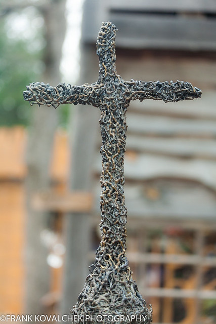 Cross made of little people