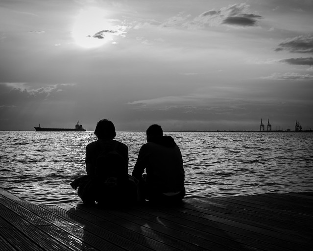 silhouettes in front of the sea