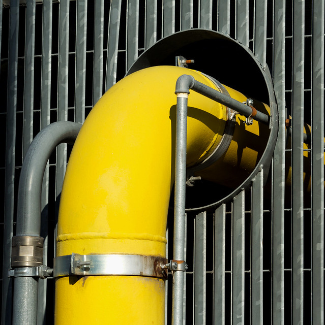 Yellow gas main, hole and grey grid ( suburbia)