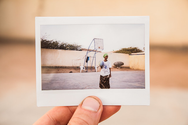 Polaroid of a Girl playing basketball in Somaliland