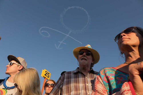 Prince skywriting over Van Morrison's set on Day 2 of Jazz Fest 2016. Photo by Charlie Steiner.