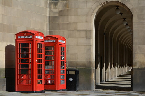 england unitedkingdom manchester manchesterstreets streetview streetscene urbanscene architektur architecture curves telephonebox red currentred k6 kioskno6 gilesgibertscott castironconstruction communication litterbin mosleystreetwest citycentre cityscape touristcity doomedroof longshadow pavement sidewalk outdoor publicuse photoborder redkiosk phonebox