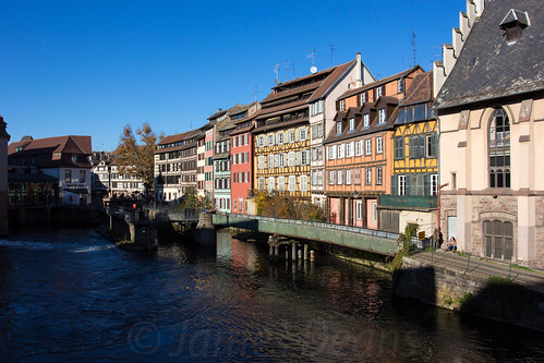 windows sun france reflection mill weather architecture buildings river landscape europe commerce power sunny bluesky canals strasbourg alsace locks mills halftimbered waterpower colourfulbuildings allsace crowsteppedgables