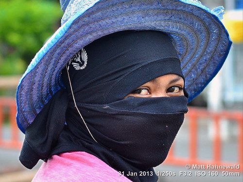 black portrait ethnic fun primelens bokeh depthoffield cultural character beautifuleyes posing authentic attractive happy street eyes matthahnewaldphotography face facingtheworld horizontal head nikond3100 outdoor songkhla hat thailand 50mm sidewaysglance bodylanguage thai headshot nikkorafs50mmf18g twothirdview clarity 1200x900pixels resized colour colourful person facecovering 4x3ratio emotional closeup consensual lookingatcamera