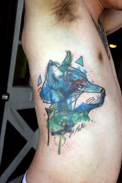 geometric watercolor wolf tattoo