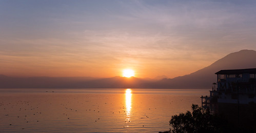 orange lake reflection water sunrise volcano fishing guatemala atitlan sanpedro lakeatitlan sanpedrolalaguna