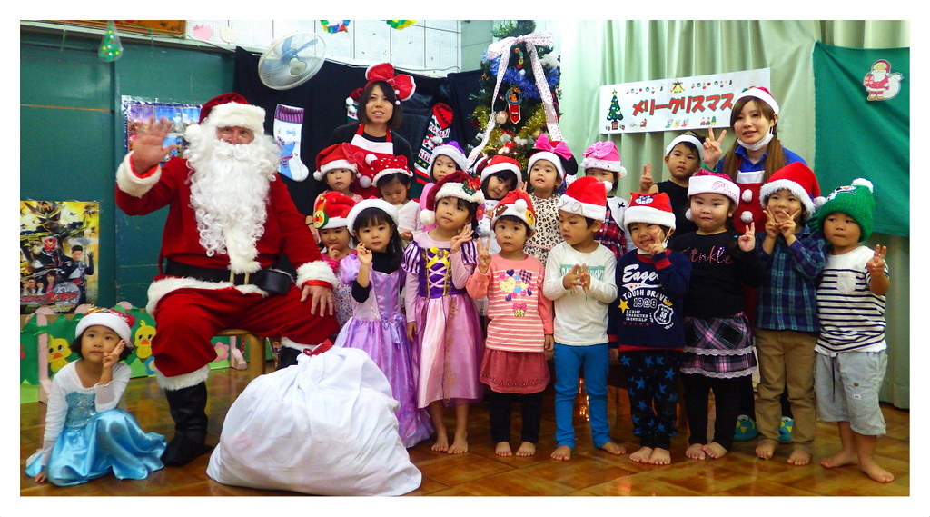 OLD SOBA... ER, SANTA CLAUS, POSING WITH A NURSERY SCHOOL CLASS in OKINAWA