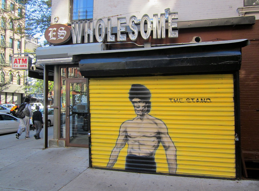 USA New York East Village near Avenue A cornerstore with Bruce Lee mural - 