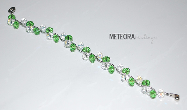 Bracelet - green and clear beads with silver spacers