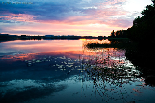 Sunset on the Lake in Ockelbo, Sweden by Svetlana Serdiukova, sunset summer sky lake color colour reflection nature water silhouette clouds colorful solitude quie
