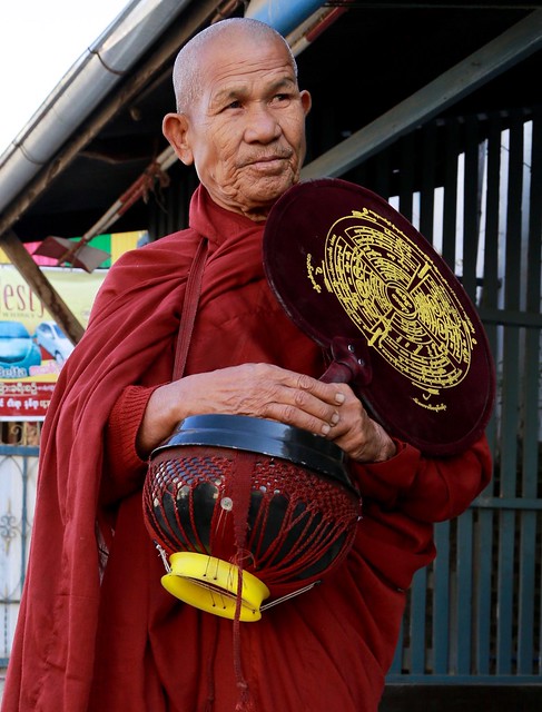 Red Robed Buddhist Monk with Begging Bowl Portrait Golden Triangle Burma Myanmar