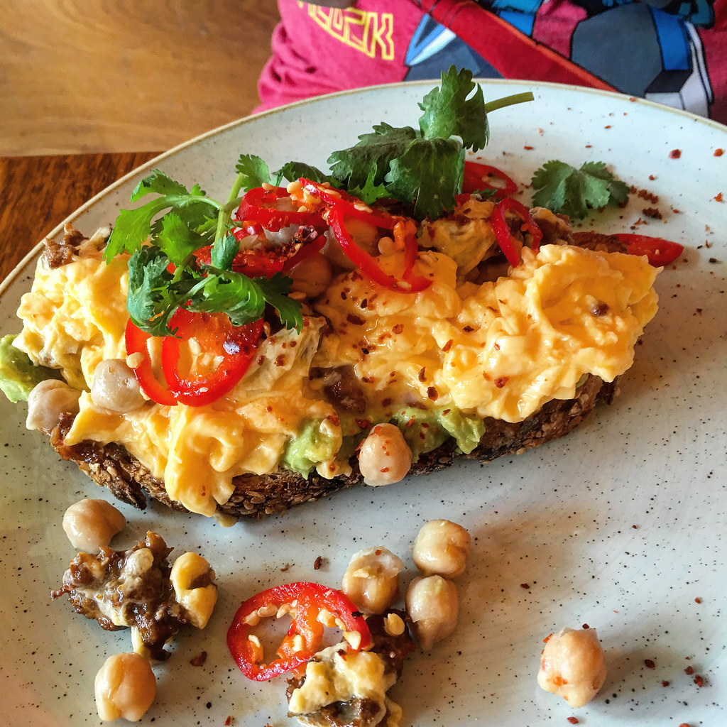 Scrambed eggs on avocado, sausage on toast at St Ali in South Melbourne