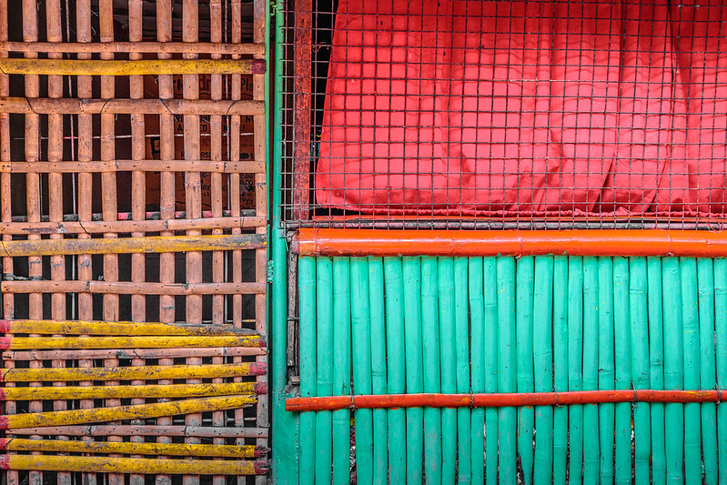 Yellow, red, teal materials making grid patterns