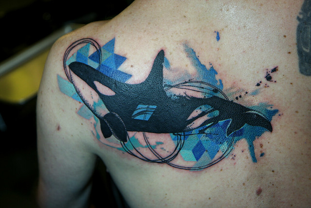 geometric watercolor orca tattoo