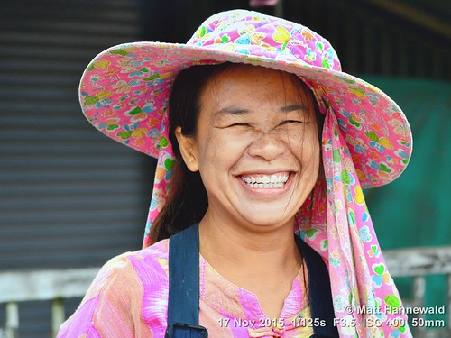 portrait smiling travel tourism market ethnic primelens woman female cultural character posing consent relationship emotion adult authentic closeup street hat eyes asia matthahnewaldphotography face facingtheworld chiangdao horizontal head nikond3100 outdoor thailand thai 50mm expression northern headshot sun fabric veil neck nikkorafs50mmf18g threequarterview 4x3ratio 1200x900pixels resized lookingatcamera colour colourful broadbrimmed person