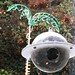 My great uncle Jim's copyrighted satellite bird feeder, forever hanging at my Dad's place. Tried to get a shot with a bird, but they are just too quick. :)
