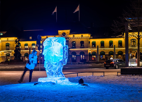 city blue winter light cold color colour art ice girl beautiful face festival night 50mm lights cool interesting phone looking view sweden sony central uppsala scandinavia scupture diffuse photostory helios442 icescupture onelegcentralstationuppsala thousandwinters