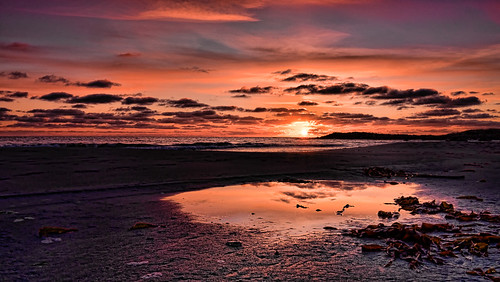 ocean light sunset red sea sky orange sun seascape reflection nature water clouds dark landscape evening coast spring waves outdoor north nobody shore northsea april