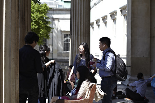 Students in the UCL portico. Photographer: Matt Clayton