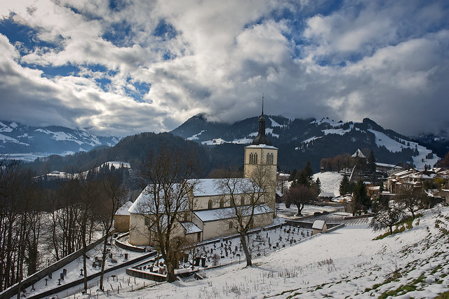 Eglise St-Théodule at winter time , Château de Gruyères .