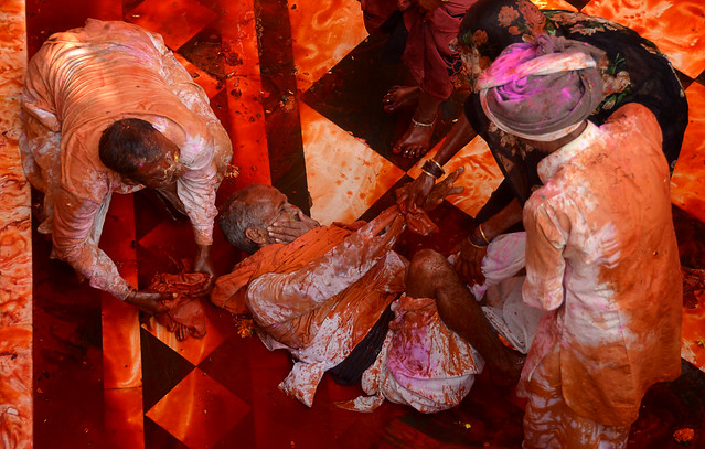 bath in holi colors at Barsana temple, India