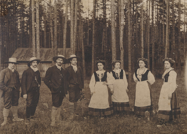 Group of men and women in costume in the woods