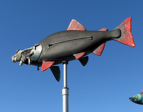 A salmon sculpture wearing a gas mask and skin diving suit in La Conner, Washington