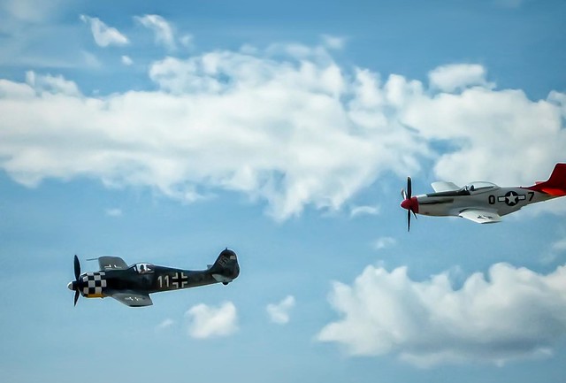 A vintage WWII aircraft gives chase during a simulated dogfight at the 2014 Air Show of the Cascades near Madras, Oregon
