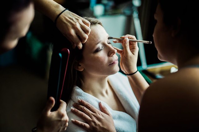 At the end of a couple week journey of northern Vietnam, I was honored to photograph Beka & Andrew's wedding. Here's one of my favorite photos of her bridesmaid's prepping and pampering her before the wedding.