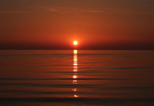 sunset glowing sea ocean sky sun