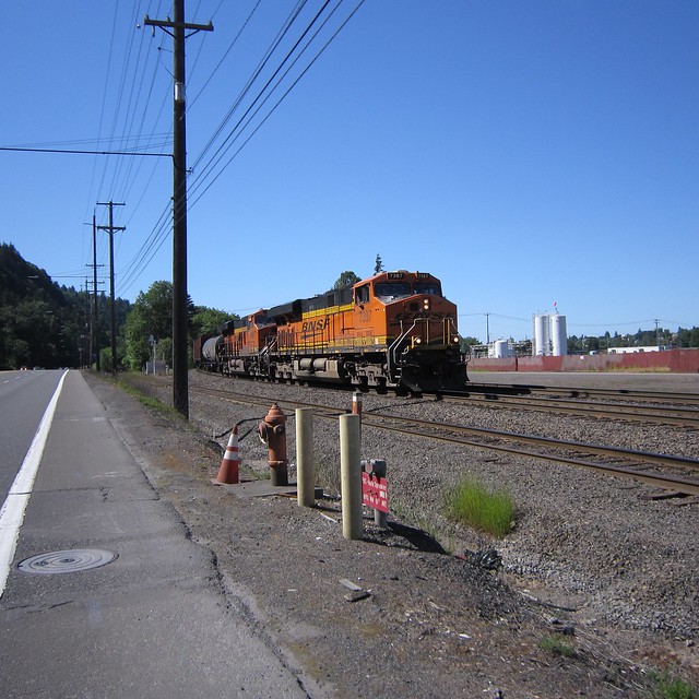 A southbound wayfreight comes off the railroad bridge as I creep northwards