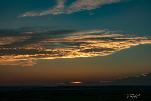 ... sunset over badlands by mariola aga, southdakota badlands evening sky clouds sunset light glow wideangle nature coth thesunshinegroup cot