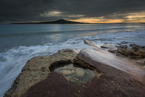 Replenish by Antony Eley, An isolated rockpool about to get it's high tide refill as the sun rises over Rangitoto Island in th