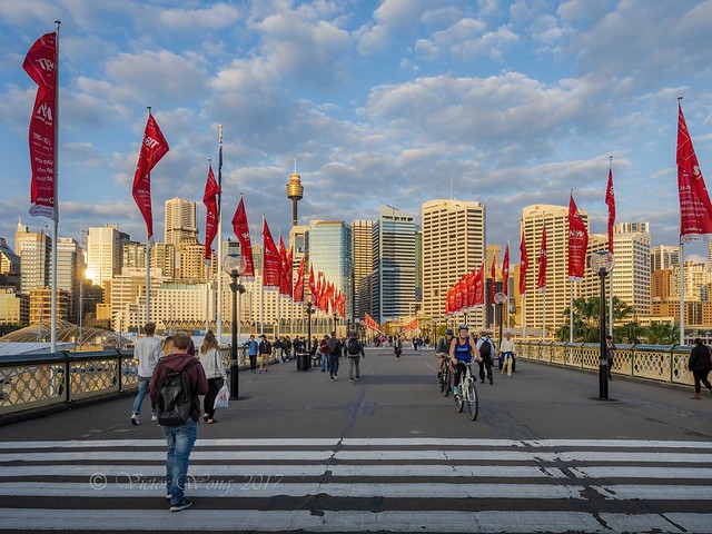 Lamps, flags and people activities on the historic Pyrmont Bridge